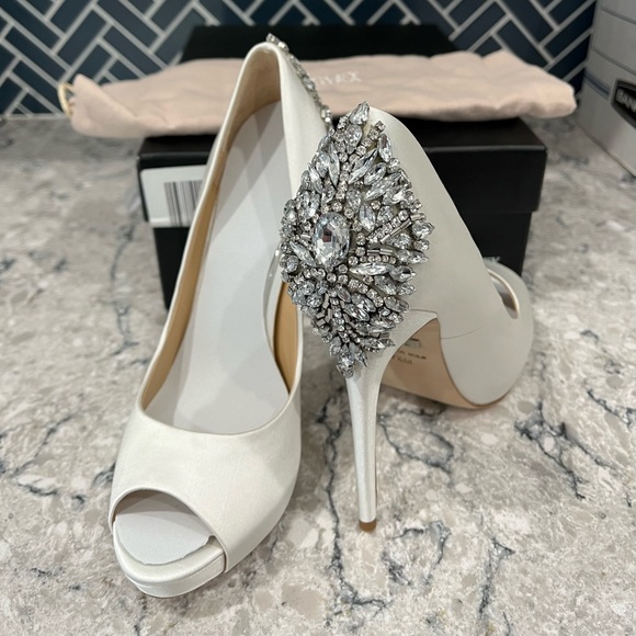 Badgley Mischka Shoes - Size 7.5 Badgley Mischka white peep-toed pumps. New with box. Retails for $245.